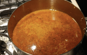 Fish curry sauce cooking inside the pot